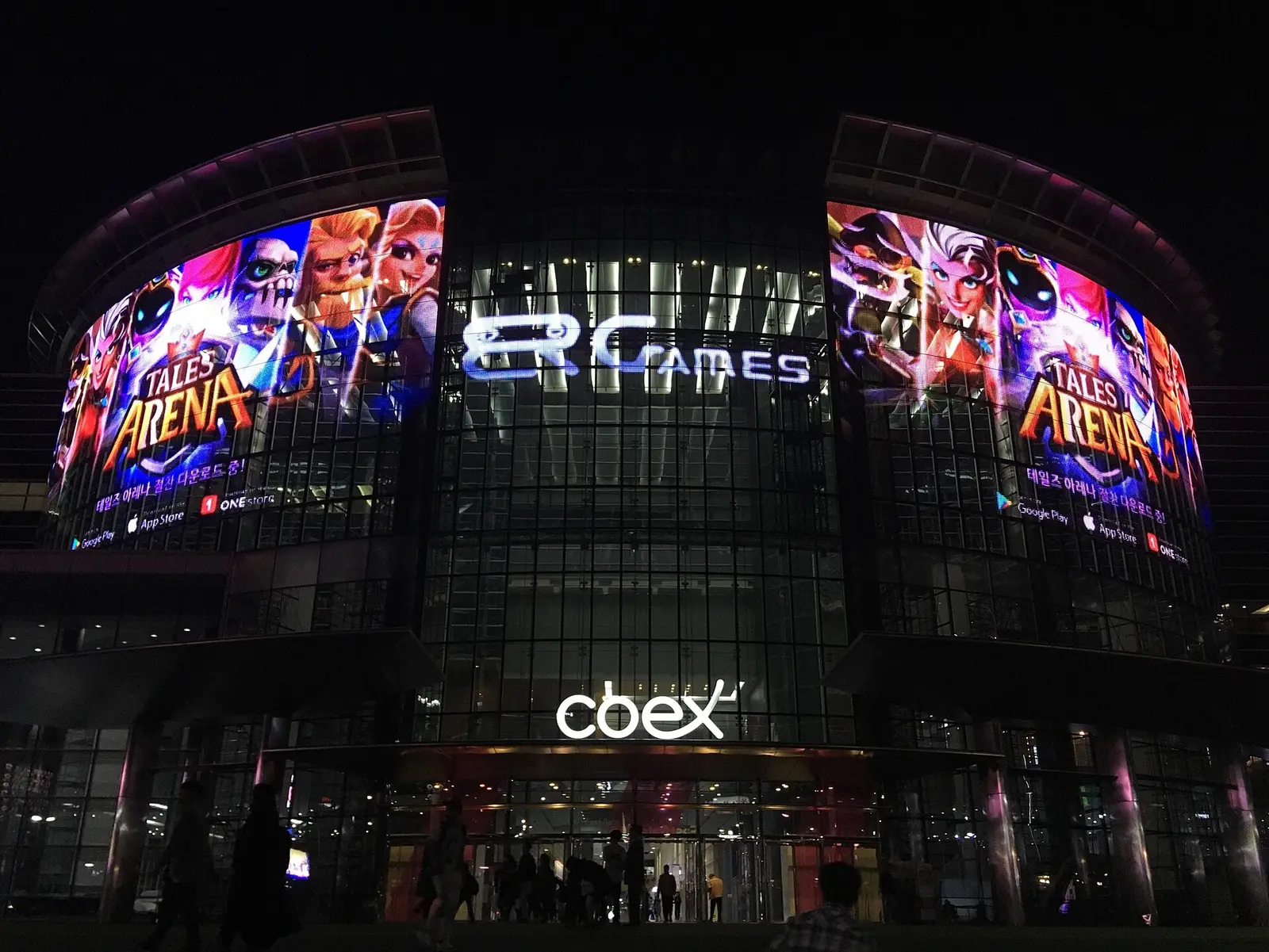 COEX Center facade at night with large illuminated screens above the entrance
