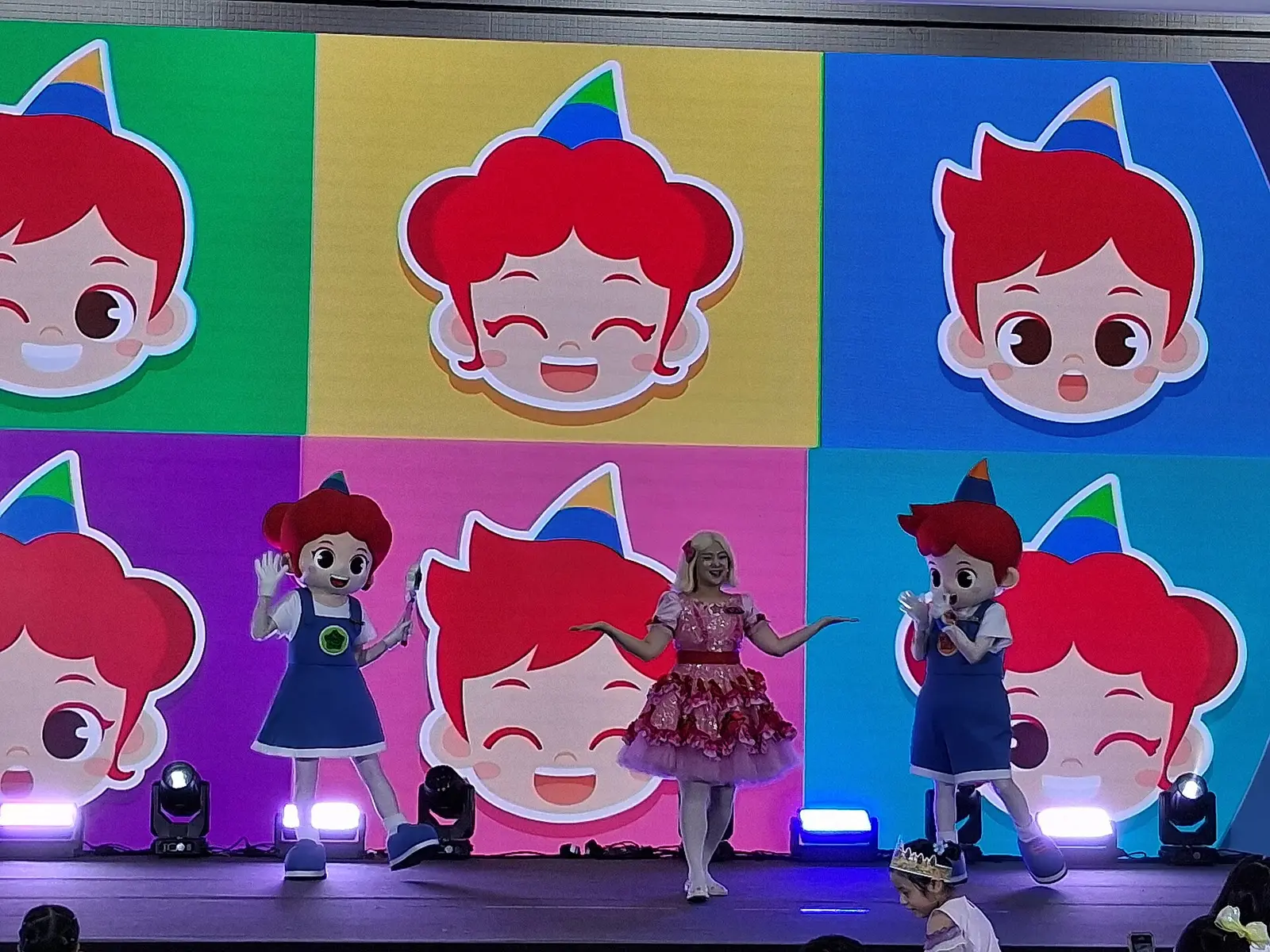 Costumed characters performing on a colourful stage at a character licensing show in COEX, Seoul