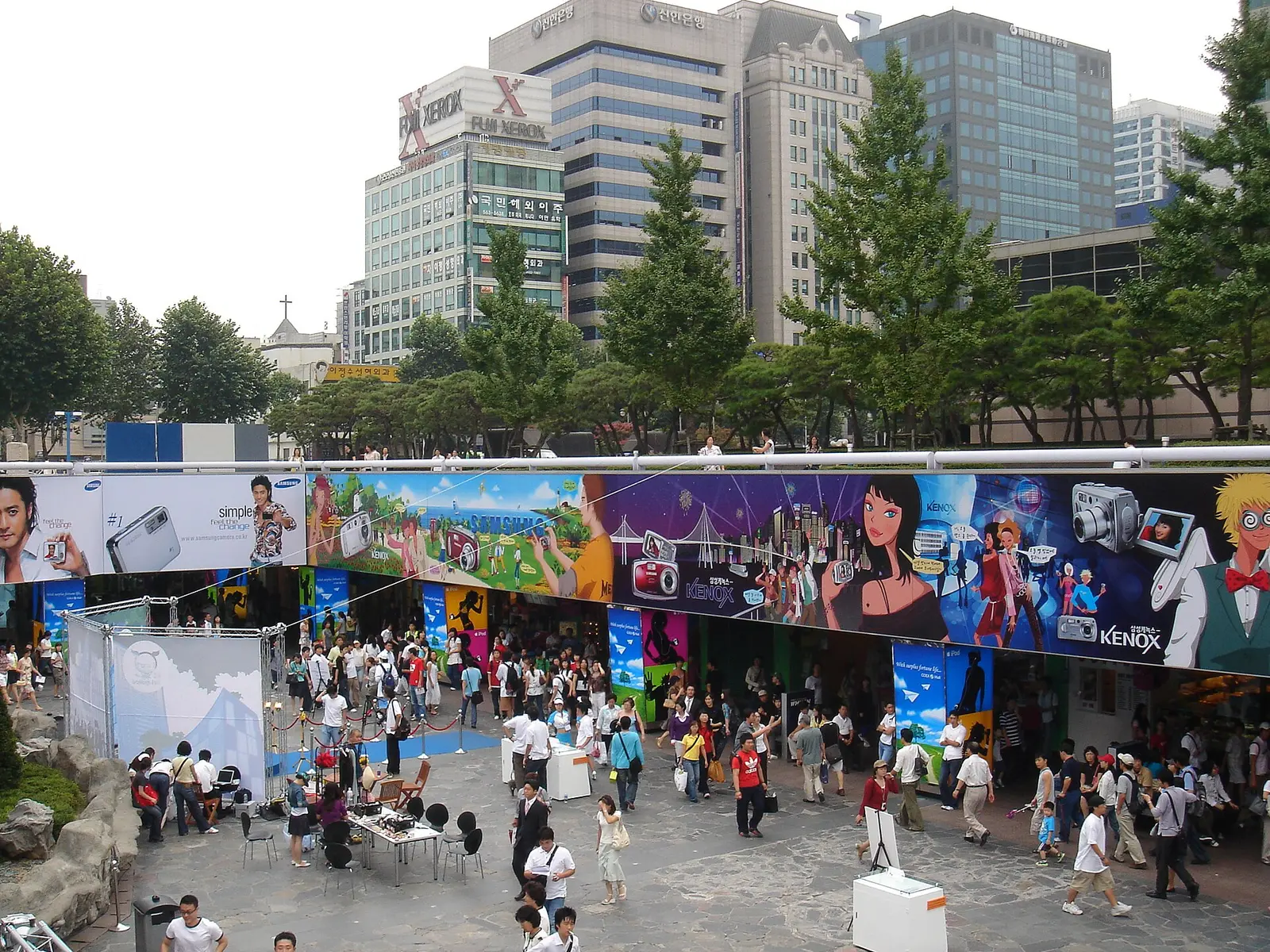 Crowd gathered in front of a painted mural outside COEX in Seoul