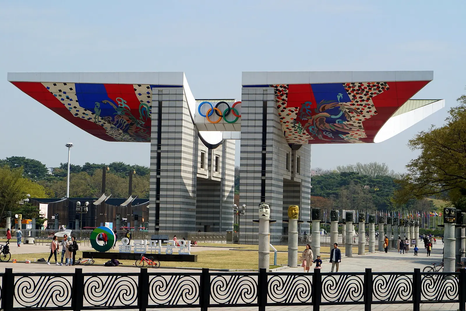 World Peace Gate in Seoul Olympic Park with visitors on the plaza